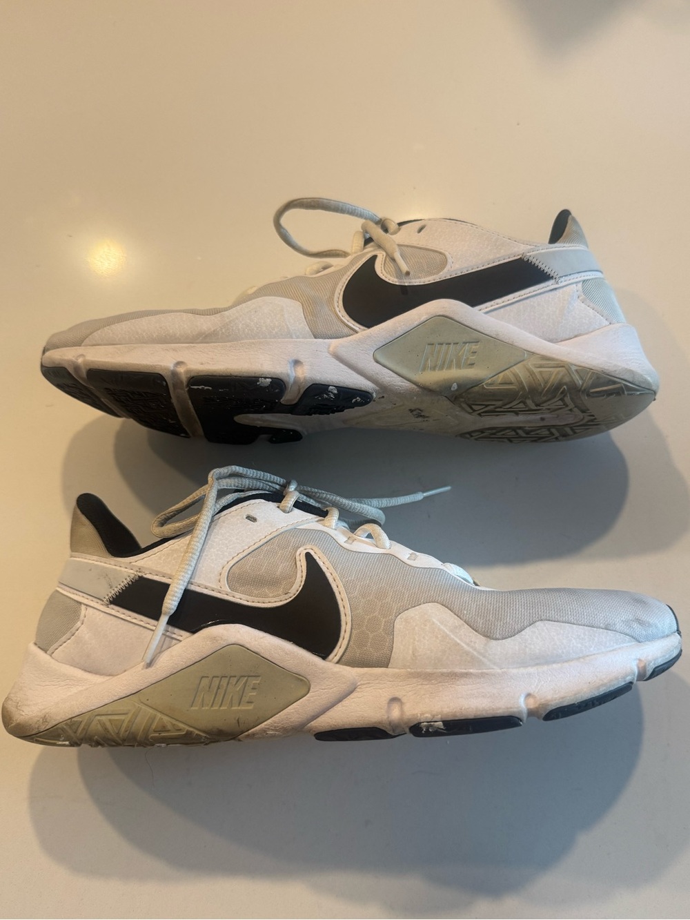Nike Legend Essential CQ9356-002 Mens Size 10 - White Sneakers with Black Swoosh